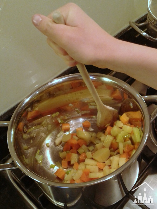 hearty harvest vegetable soup stirring