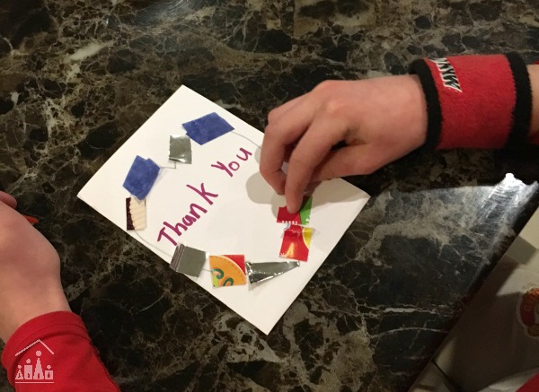 Child making a thank you card